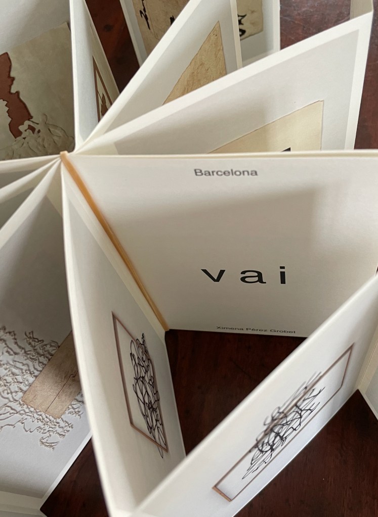 An open artist's book featuring intricate illustrations and text, displaying the word 'vai' along with 'Barcelona' and the author's name, Ximena Pérez Grobel.