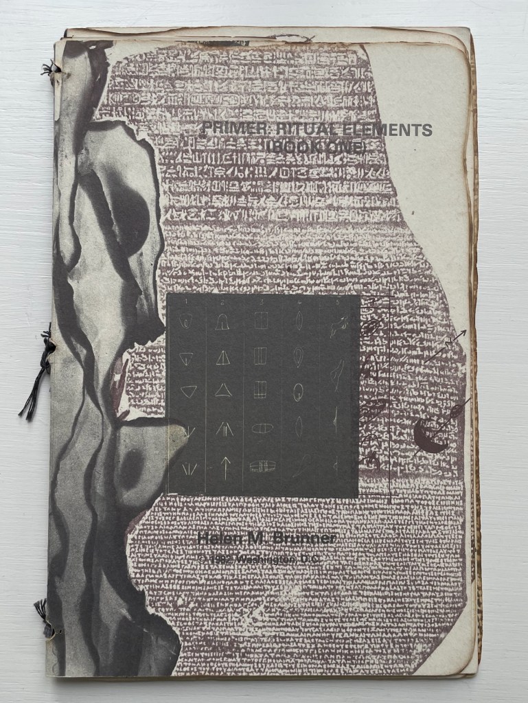 An artistic cover of a book titled 'Primer: Ritual Elements' by Helen M. Barger, featuring ancient script designs and abstract shapes.