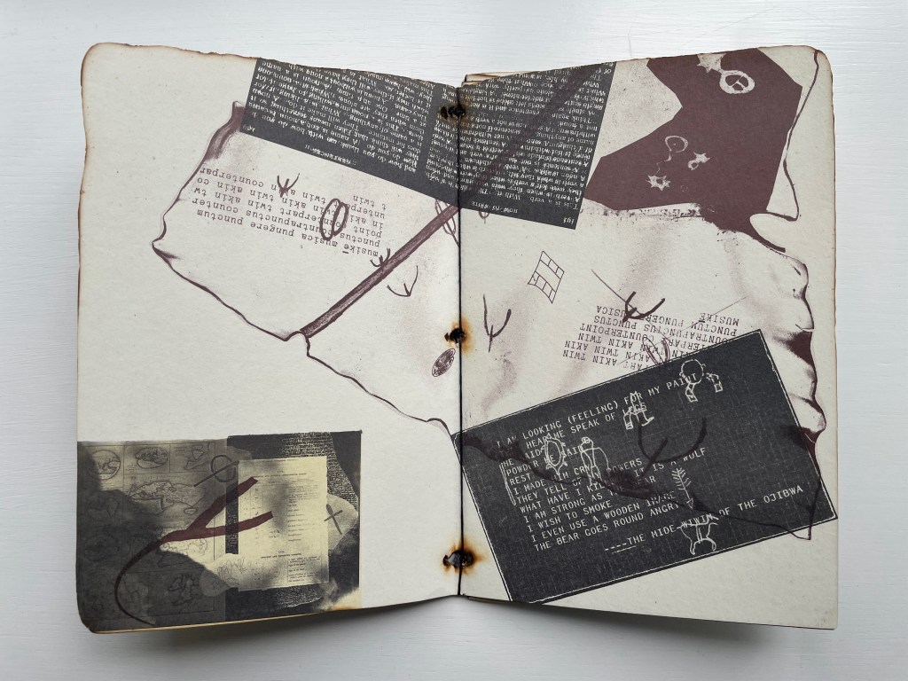 An open scrapbook with a collage of various printed texts, sketches, and abstract designs, featuring a mix of black, brown, and white colors.