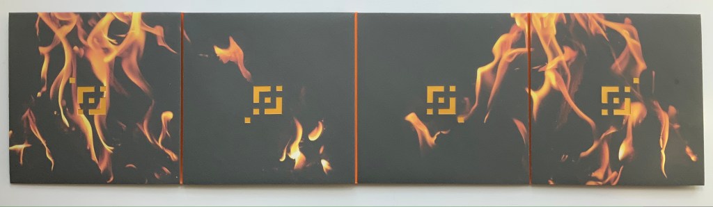 A closed accordion book featuring a dark cover with flame imagery and geometric yellow designs on each section.