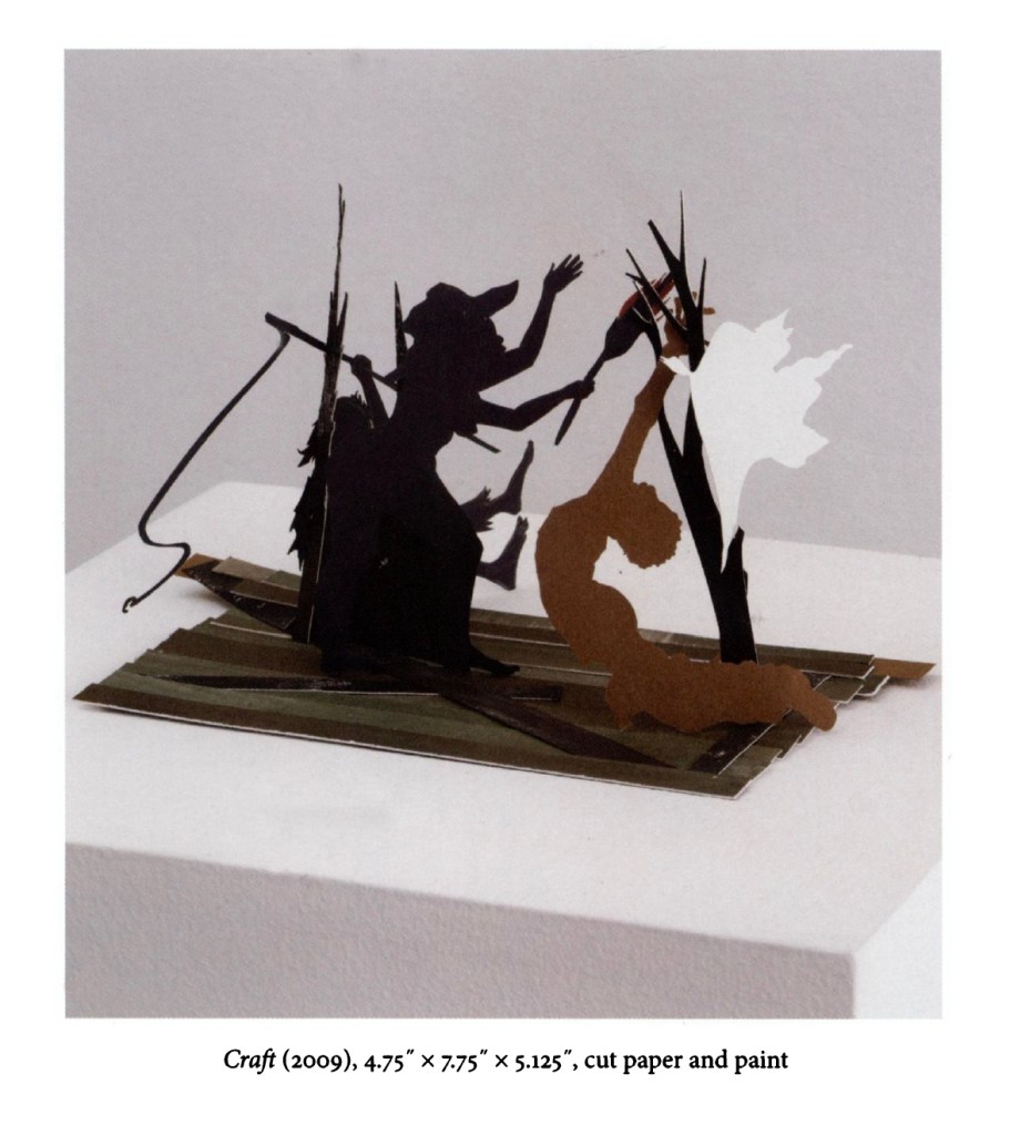 A three-dimensional paper sculpture depicting a scene with two figures, one in a dark outfit and the other in a light color, interacting amidst stylized trees.