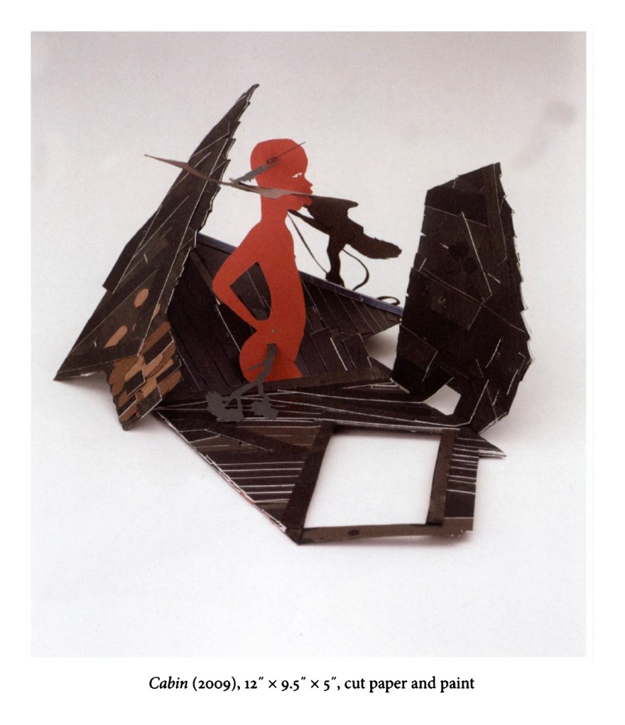 A three-dimensional paper sculpture titled 'Cabin' from 2009, featuring a red figure and various shaped black panels.