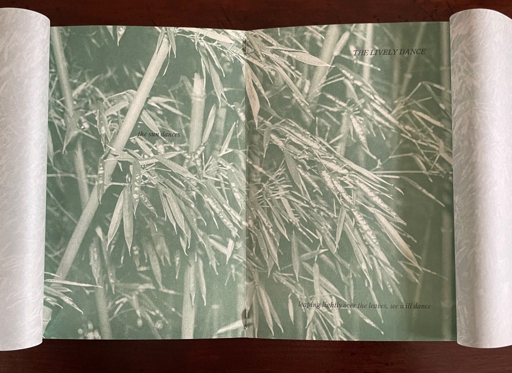 A printed page featuring bamboo leaves in a soft green tone with text. The top text reads 'THE LIVELY DANCE' and the bottom text says 'leaping lightly over the leaves, we will dance.'