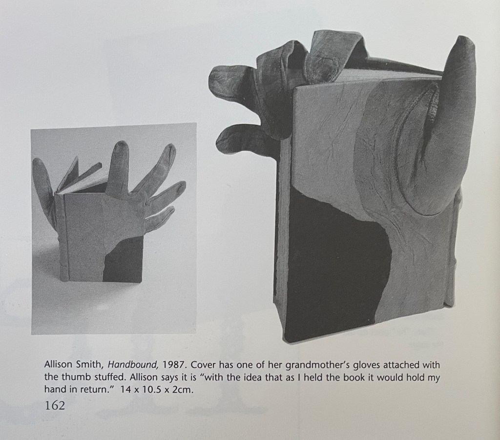 Artistic book titled 'Handbound' by Allison Smith, featuring a unique cover design that incorporates a glove attached to the book's spine.