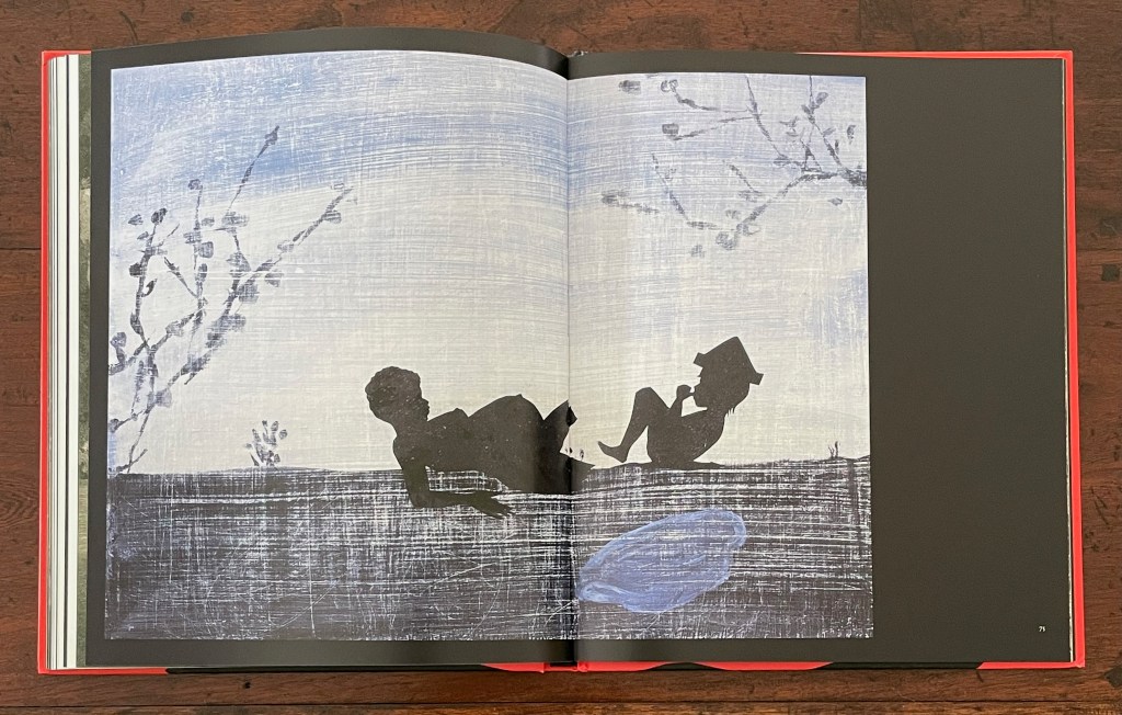 An open book showing a double-page illustration featuring silhouetted figures of a boy and a girl under a branch. The background has a textured, light blue and gray color scheme.