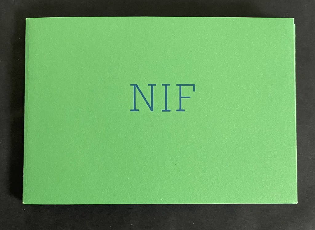 A green booklet with the letters 'NIF' printed in blue on the front cover.