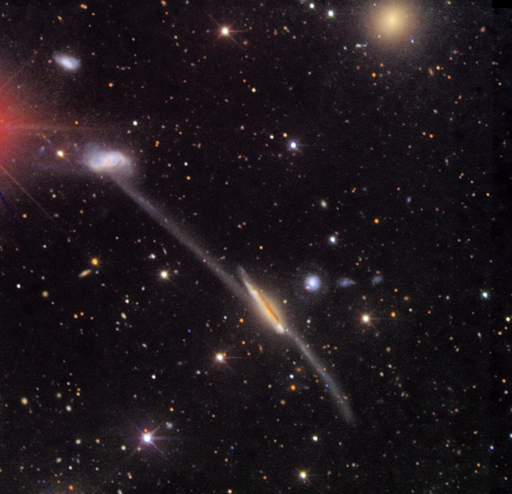 A stunning image of a galaxy cluster filled with various galaxies, stars, and cosmic dust against a dark backdrop of space.