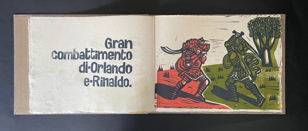 Illustration depicting a battle between two armored knights in a landscape, with text in Italian reading 'Gran combattimento di Orlando e Rinaldo.'