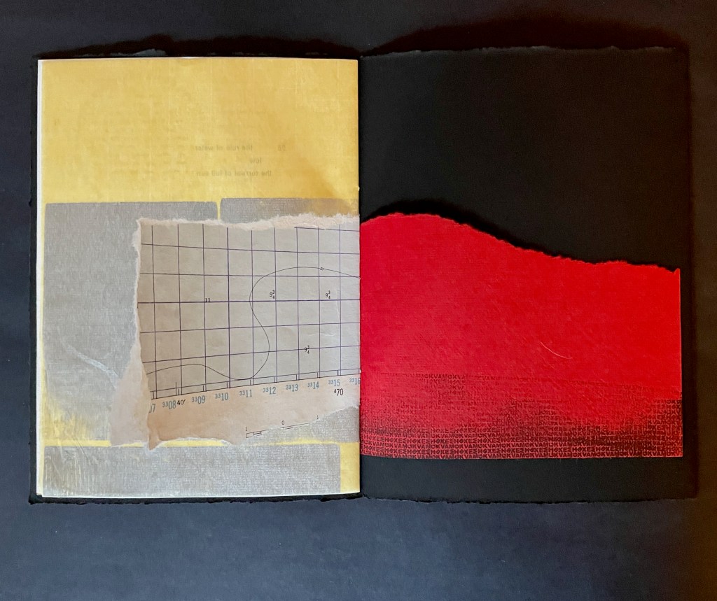 An open book with yellow and black pages, featuring a patch of textured paper with a grid pattern on the left side and a bold red section on the right side.