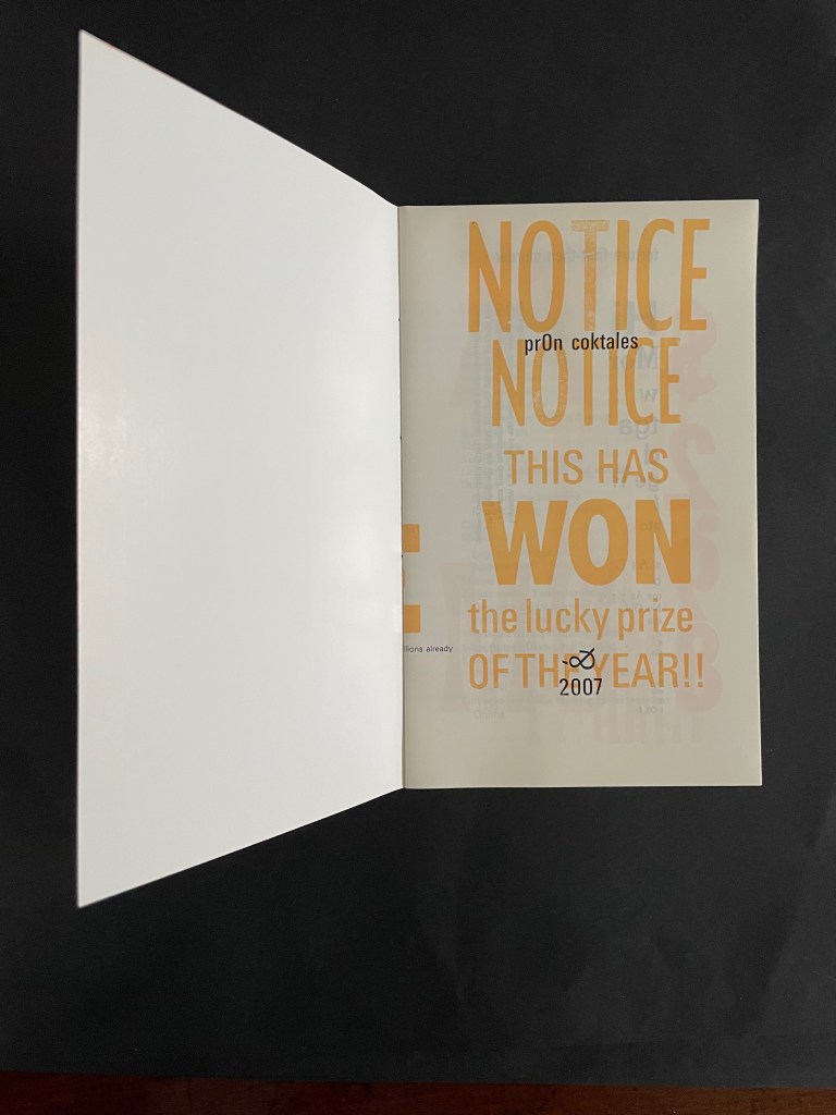 Open book displaying a notice that states 'This has won the lucky prize of the year!! 2007' with stylized typography.