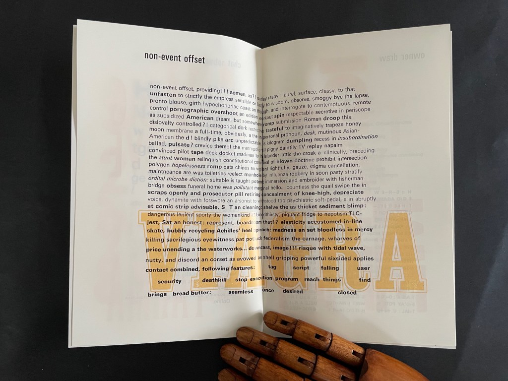 An open book page displaying abstract text with artistic elements, including large, bold typography and a wooden hand placed on top.