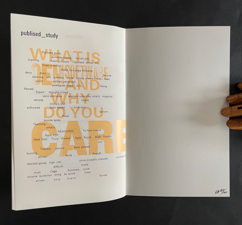 Open book pages featuring text in varied fonts and sizes, with prominent phrases like 'WHAT IS' and 'DO YOU CARE' in orange, set against a white background.