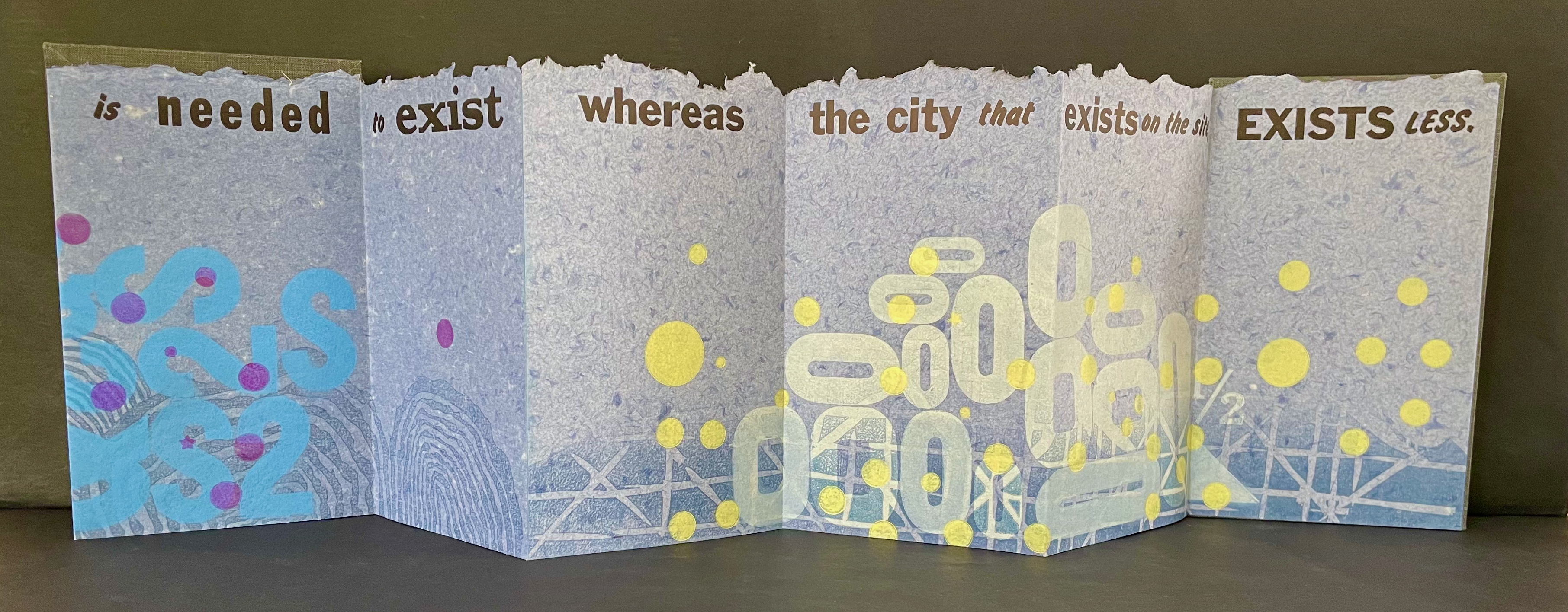 Artistic folded paper display with abstract designs and colorful shapes, featuring text fragments including 'is needed', 'exist', and 'EXISTS LESS'.
