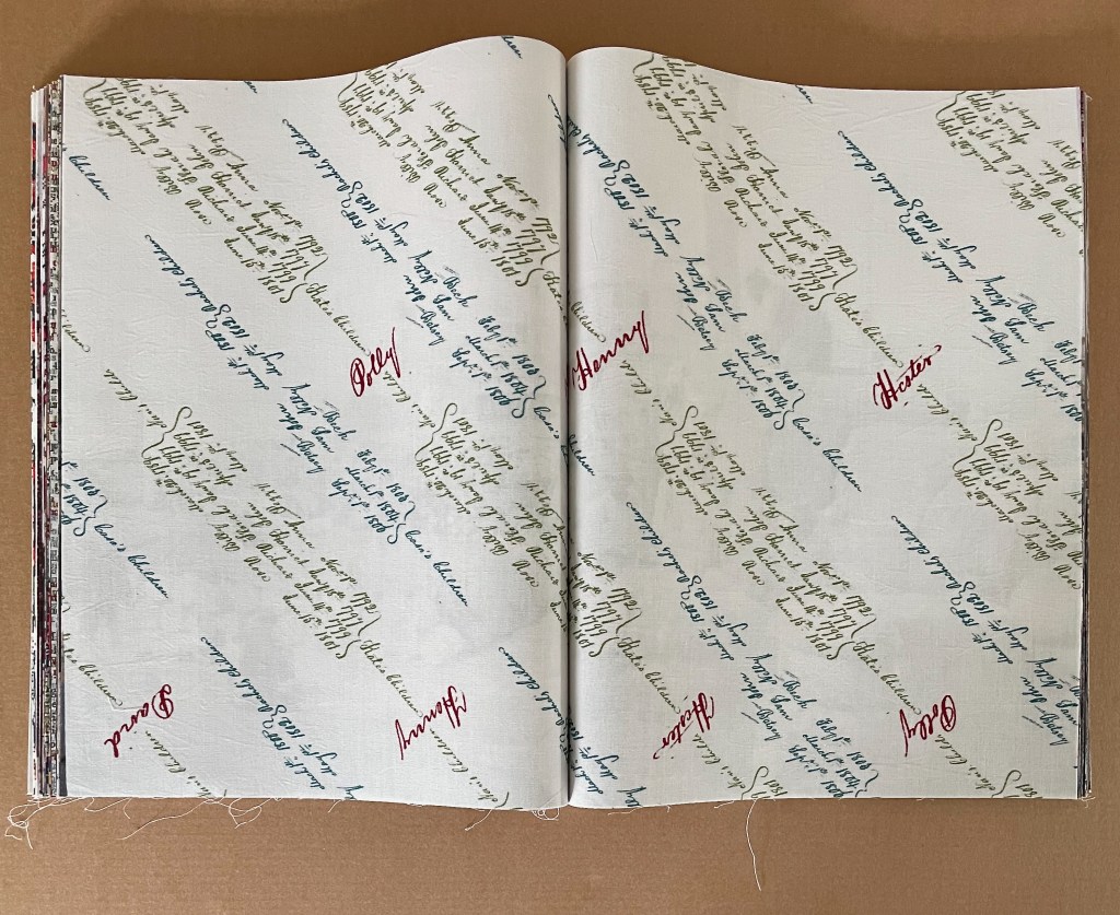 An open book displaying pages with colorful handwritten text in different fonts, featuring red, green, and blue ink on a light background.