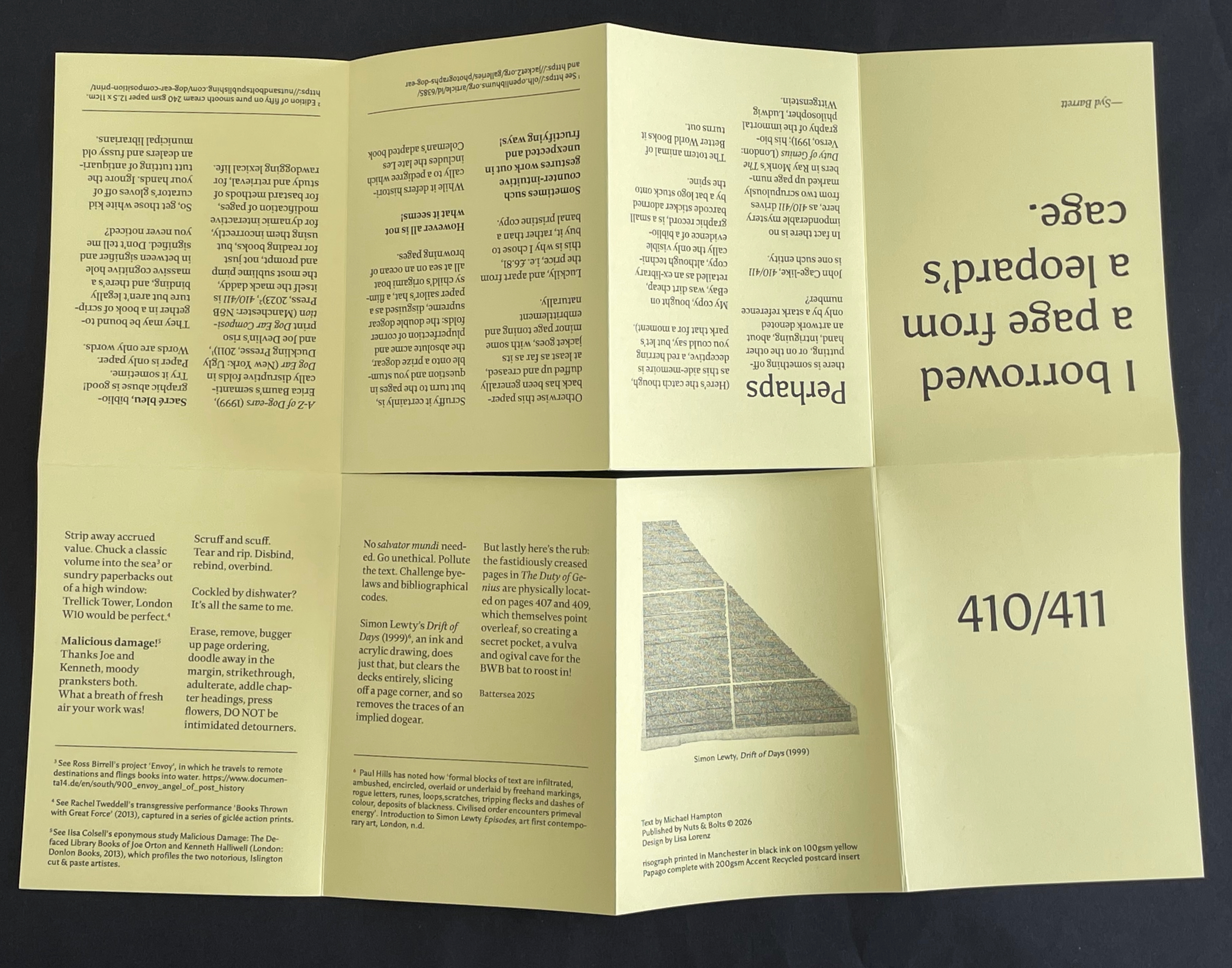 A folded yellow brochure featuring text and a graphic design, including references to books and bibliographical information, with the title 'I borrowed from a reparation's cage.'
