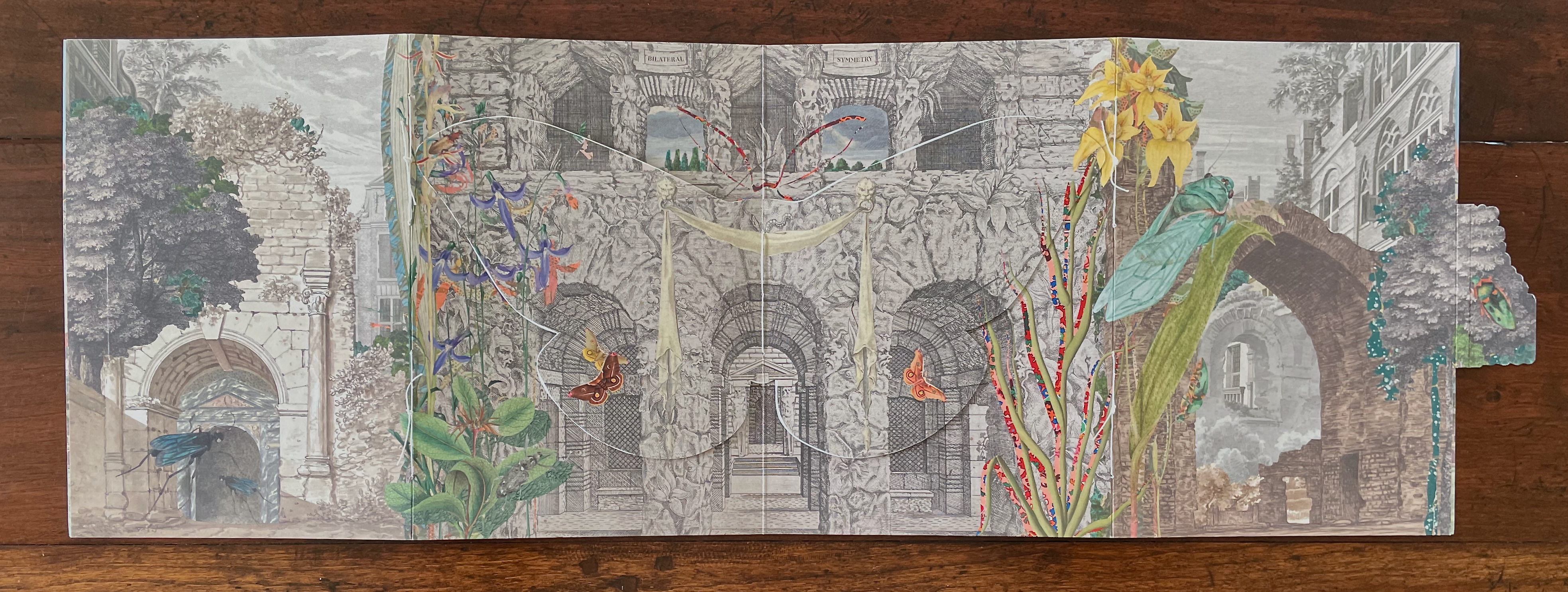 An illustrated pop-up book page featuring a detailed scene of ancient ruins surrounded by vibrant flowers, butterflies, and insects. The background includes stone arches and architectural details, blending nature with a historic setting.