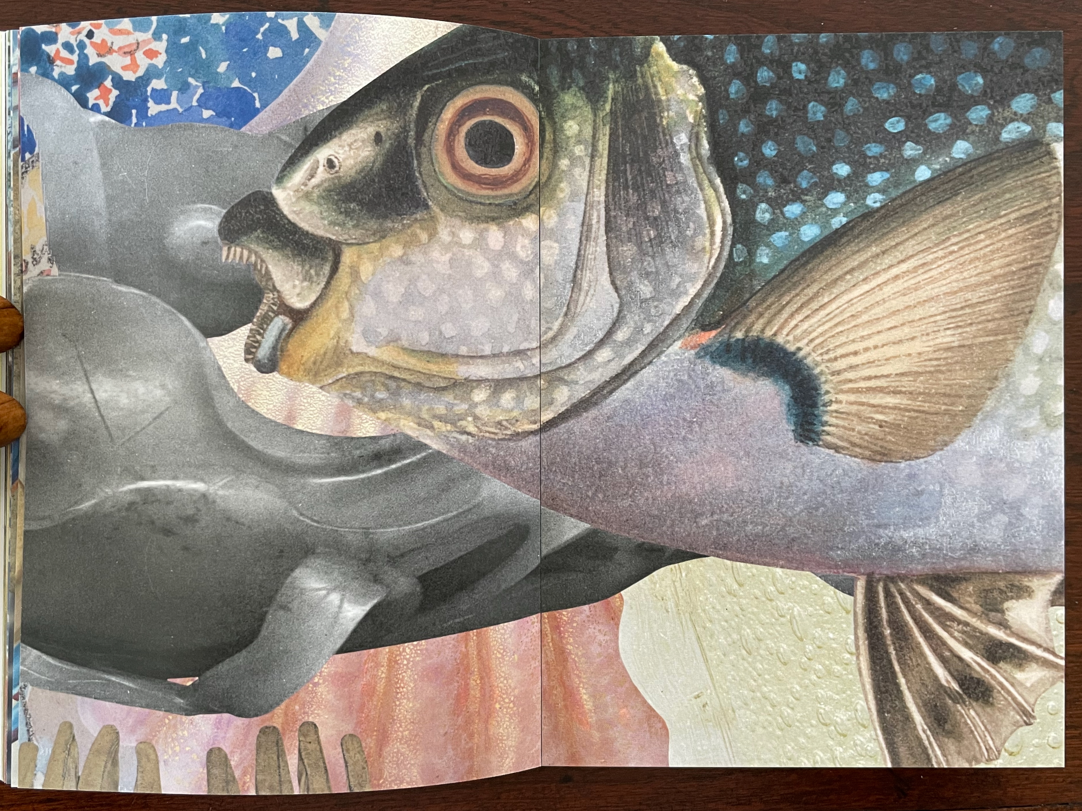 Close-up of a colorful fish illustration on a patterned background, showing intricate details of the fish's features and textures.
