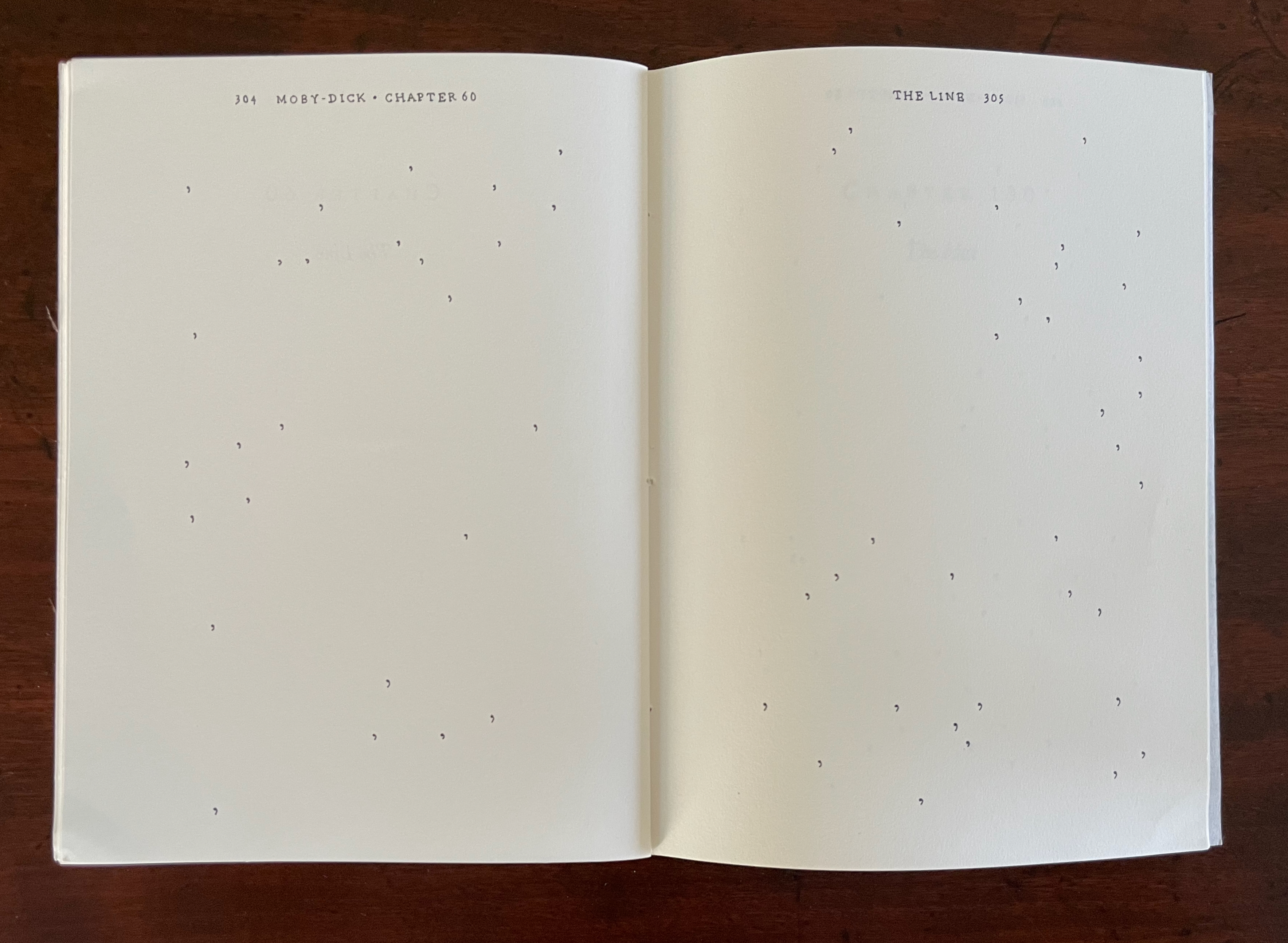 An open book displaying the title 'Moby-Dick - Chapter 60' alongside a few scattered dot patterns on blank pages.