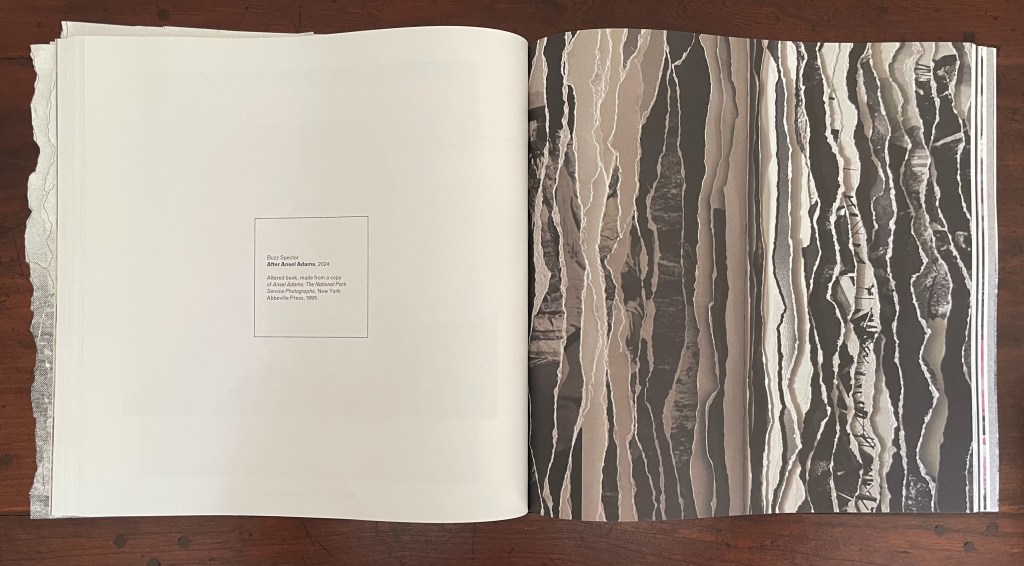 An open art book displaying a textured black and white photograph on the right page, alongside a caption on the left page that attributes the image to Ansel Adams, dated 2004.