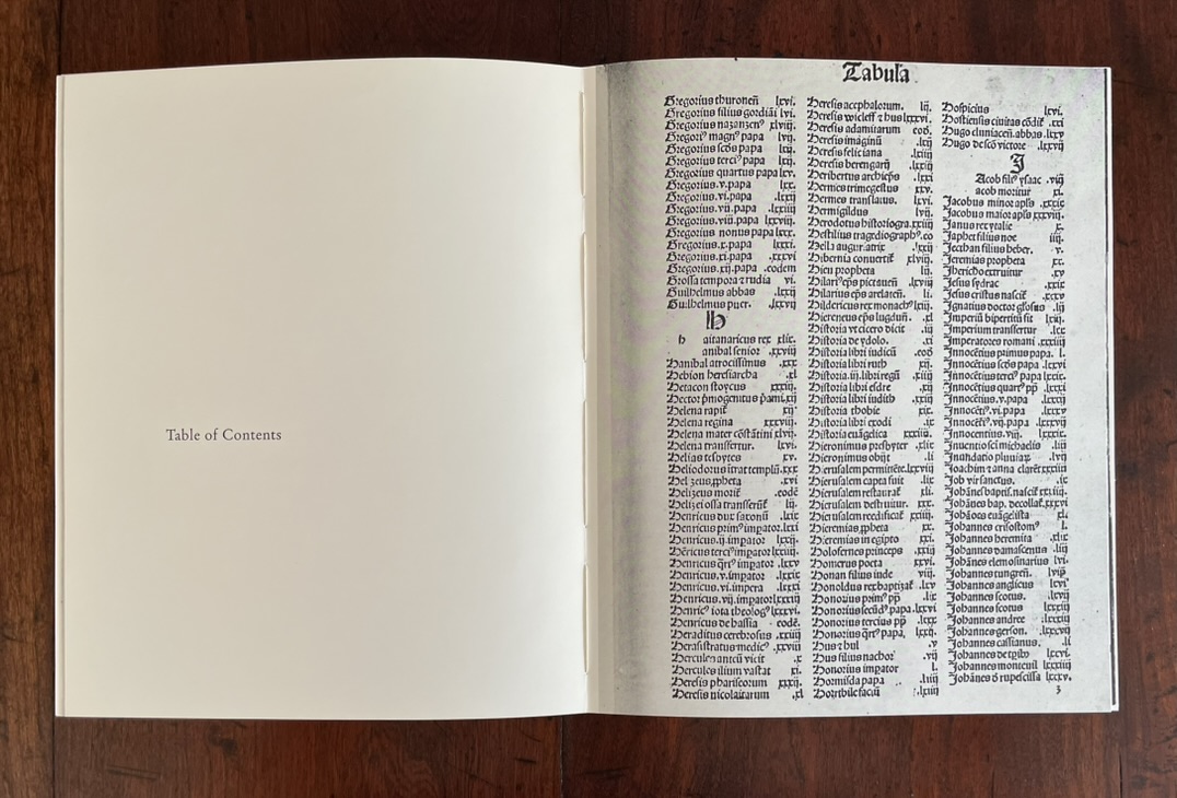 Open book page showing a table of contents with Latin text on the right side and a blank white page on the left.