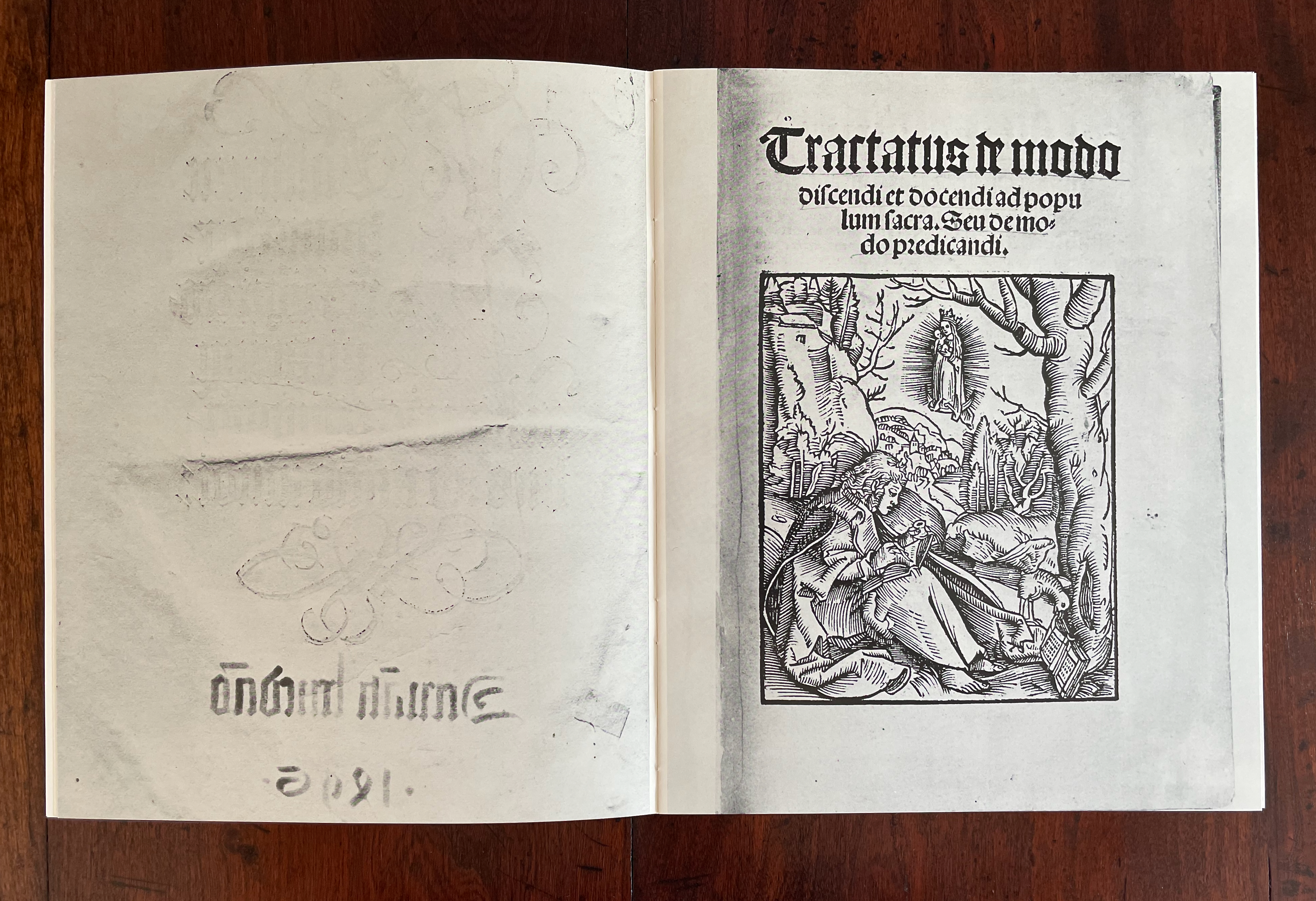 An open book page featuring a title 'Tractatus in modo' at the top, with an intricate woodcut illustration depicting a figure surrounded by nature, trees, and a distant figure, accompanied by faint handwritten notes on the lower left corner.