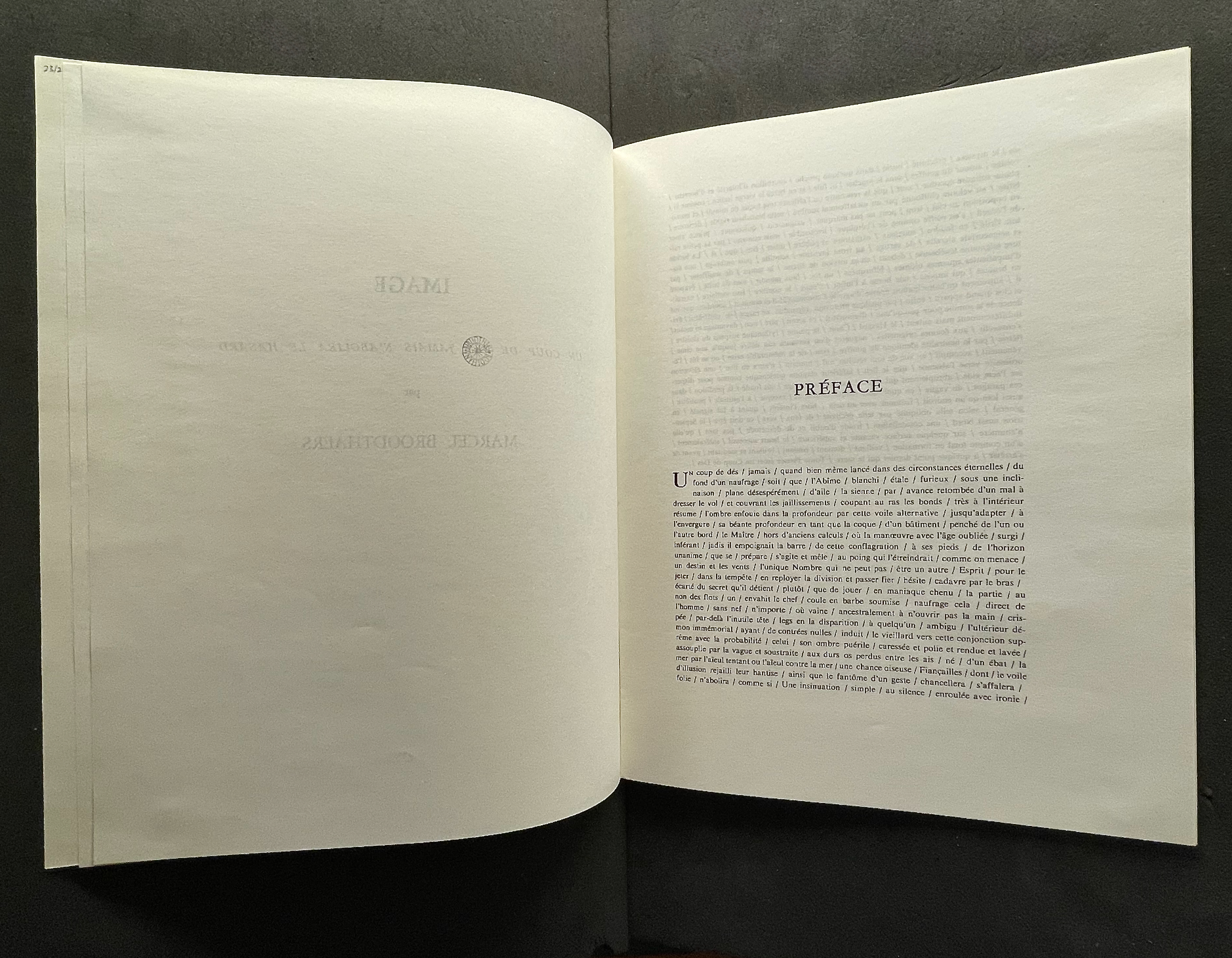 An open book displaying the text 'PRÉFACE' on the right page, with partially visible text on the left page.