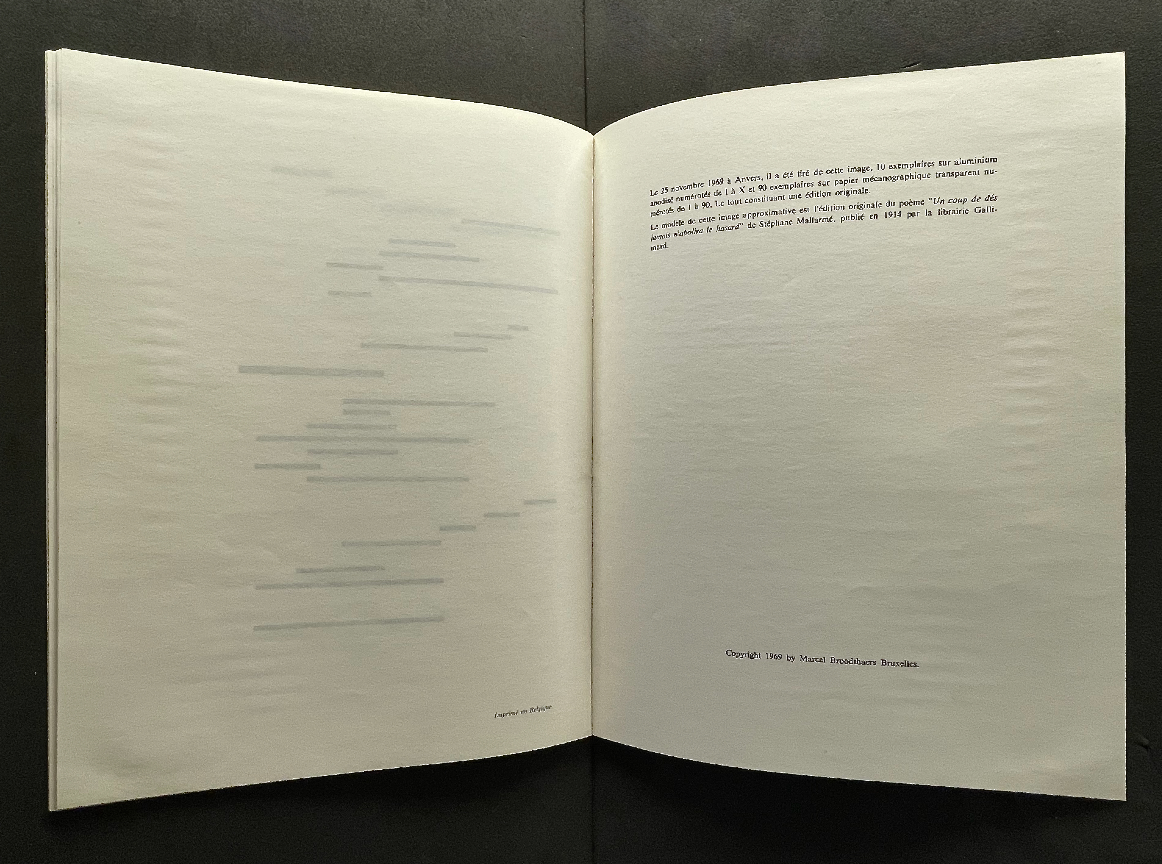 An open book displaying a blank left page with faint horizontal lines and a right page containing printed text in French, discussing its origin and publication details.