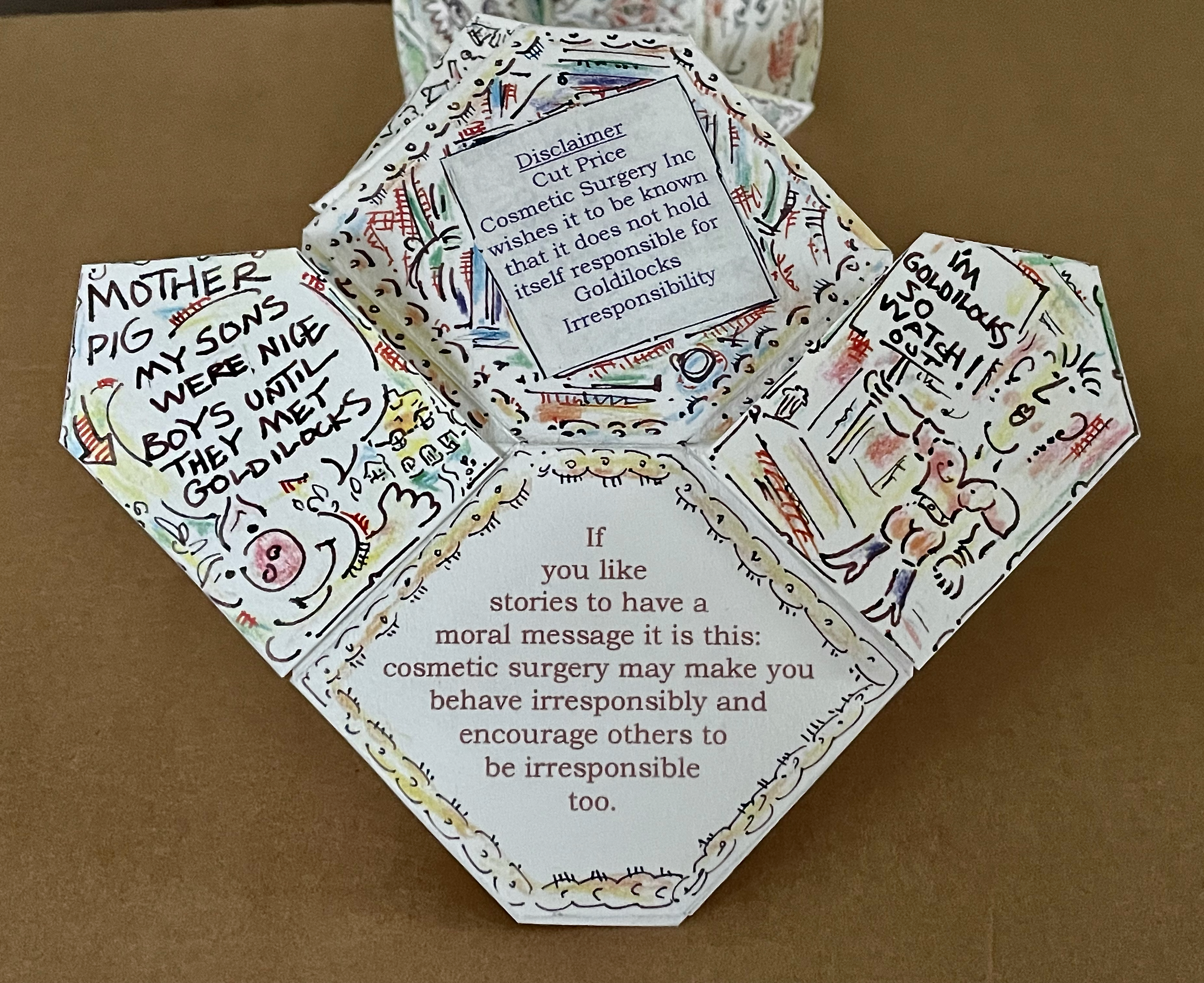 A colorful, hand-drawn paper fortune teller featuring humorous text about cosmetic surgery and its potential consequences, including warnings and whimsical illustrations.