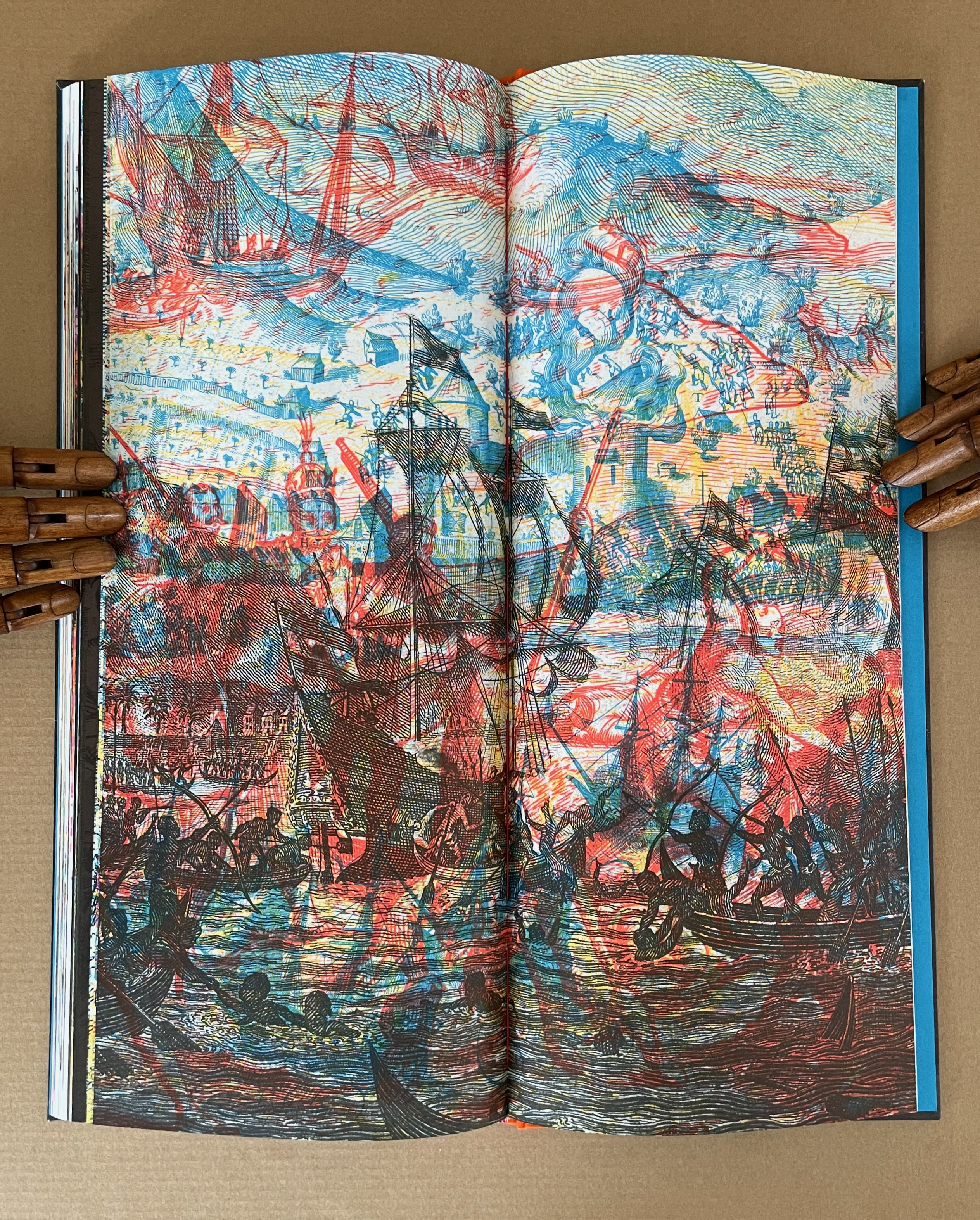 An illustrated open book page depicting a dramatic naval battle scene with colorful ships, warriors, and swirling clouds in red and blue hues.