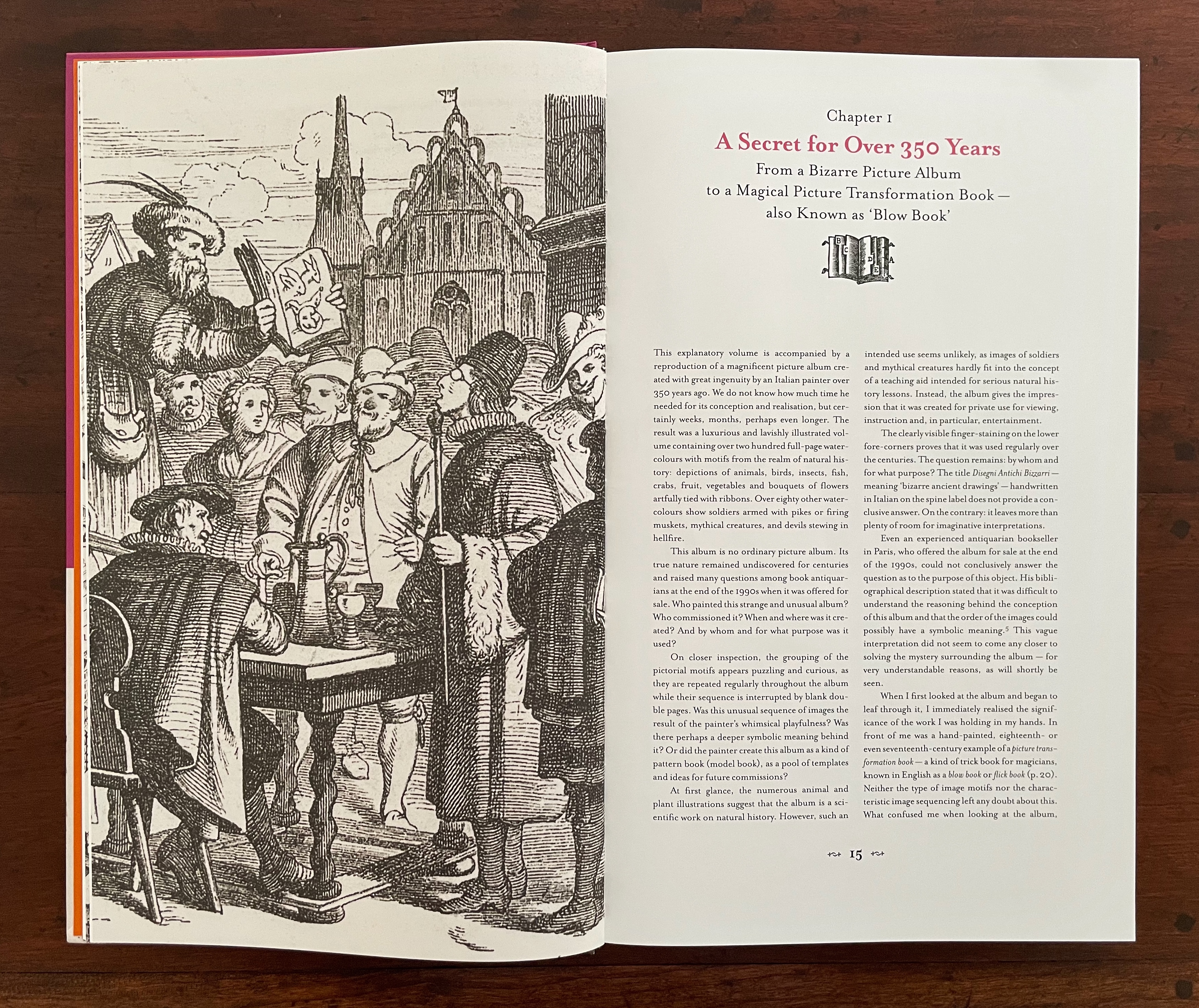 An open book with a detailed illustration on the left page depicting a historical scene with several people and a man presenting an image, and text on the right page introducing Chapter 1 of the book.