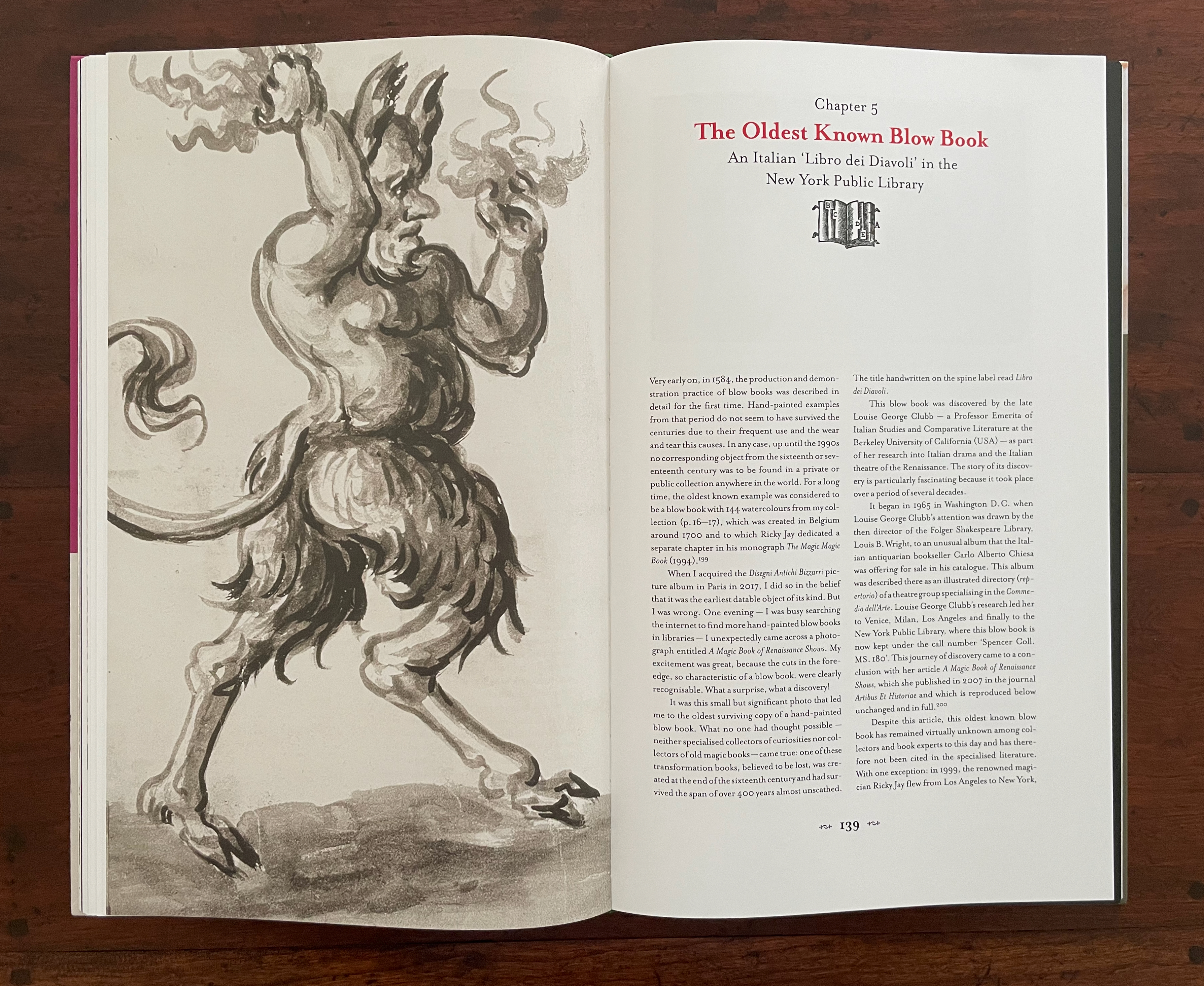 A two-page spread featuring a chapter title about the oldest known blow book, accompanied by an artistic illustration of a mythical creature with horns and smoke rising from its hands on the left page.