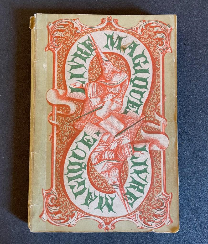 A vintage book cover titled 'The Magician', featuring ornate illustrations of a wizard with a pointed hat and a staff, in red and green colors, against a beige background.